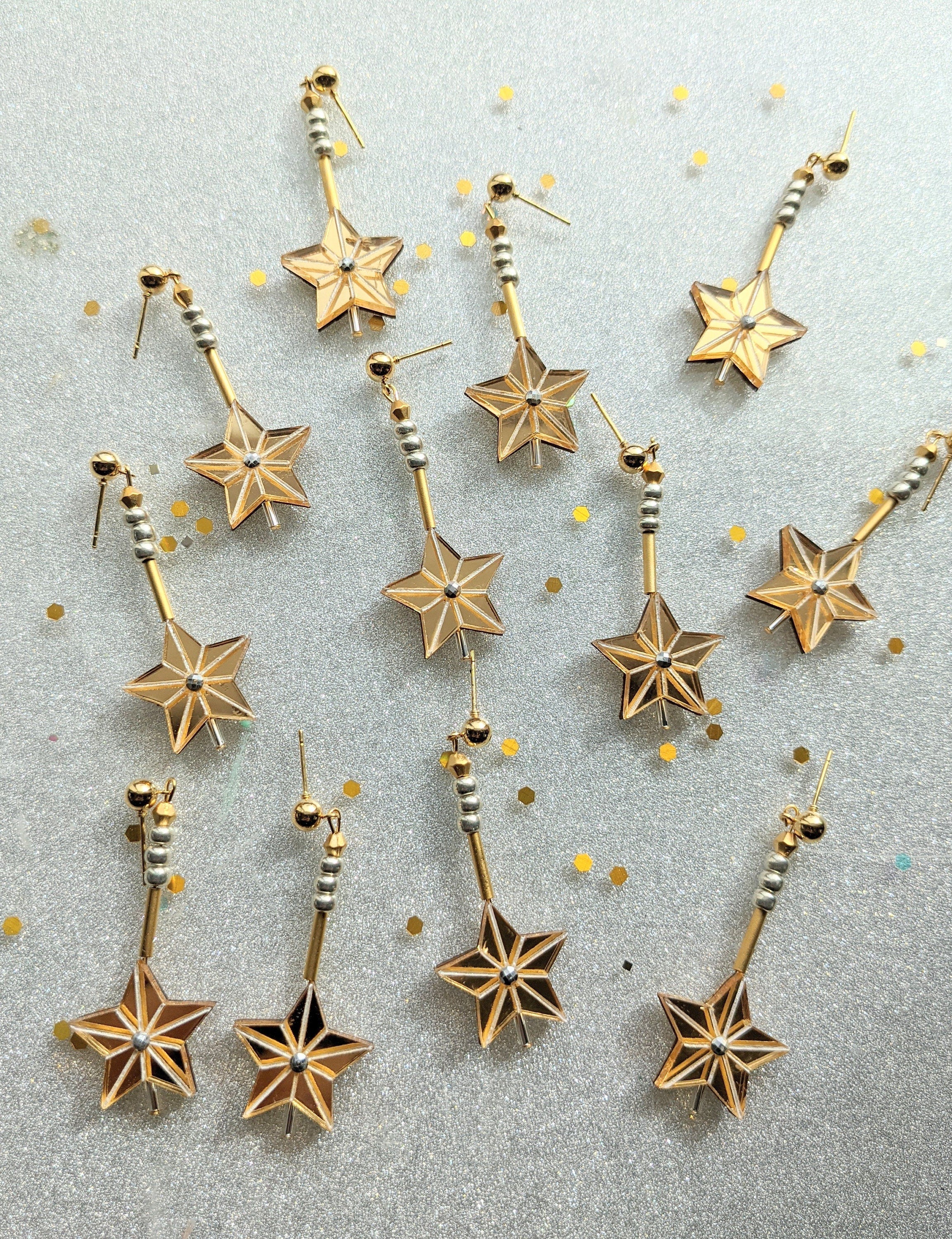 Gold star dangle discount earrings